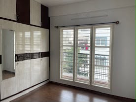 Premium apartment interior — bedroom with fitted wardrobe